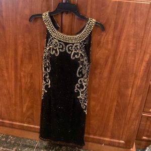 Black and gold mini dress, perfect for weddings or other semi formal events .
